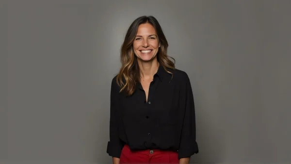 Smiling Person in Black Shirt and Red Pants