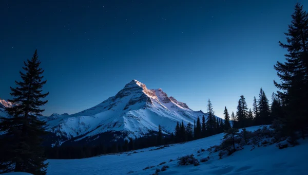 Snow-Covered Mountain Peak Under Starry Sky