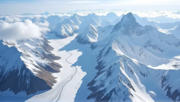 Snow-Covered Mountain Range With Alpine River