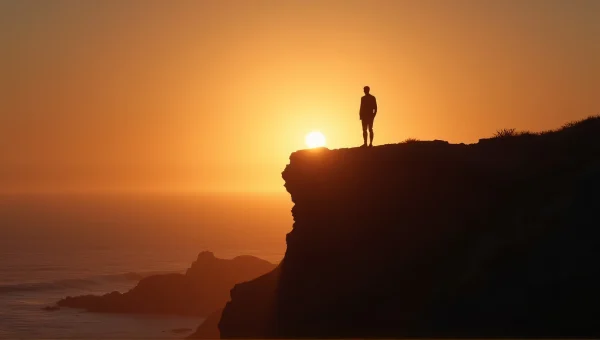 Solitary Man Silhouette on Windswept Cliff at Dusk