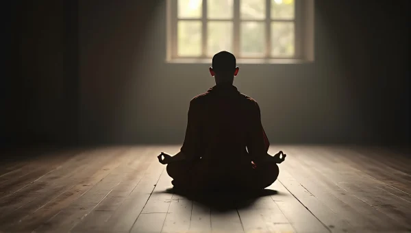 Solitary Monk Meditating on Wooden Floor