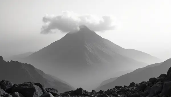 Solitary Mountain Peak With Dramatic Clouds