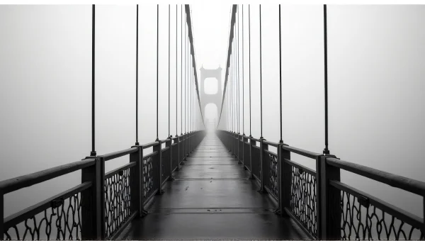 Suspension Bridge in Fog: Grayscale Perspective View