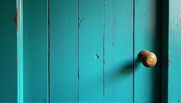 Teal Wooden Panel Door With Aged Brass Knob