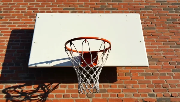 Urban Basketball Hoop Against Weathered Brick Wall