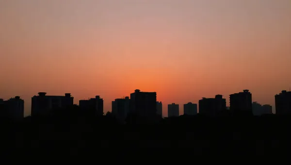 Urban Skyline Silhouette at Dusk with Gradient Sky