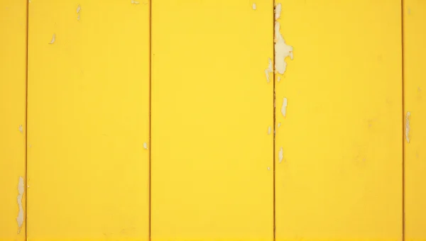 Weathered Yellow Wooden Wall With Peeling Paint