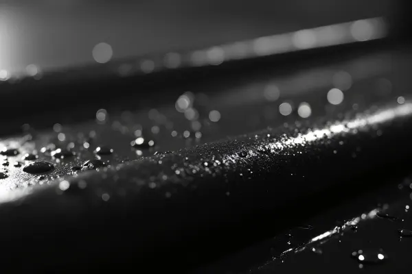 Wet Metal Frame Close-Up With Reflective Droplets