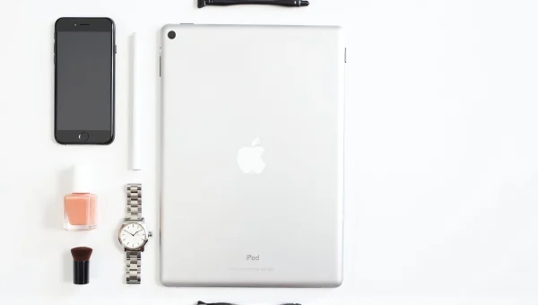 White iPad Flatlay With Accessories And Makeup