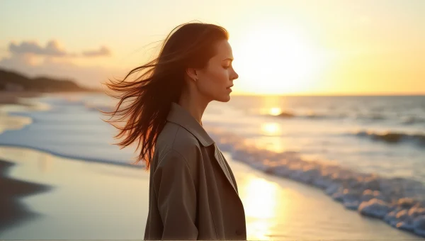 Woman by Ocean Edge with Wind-Tossed Hair