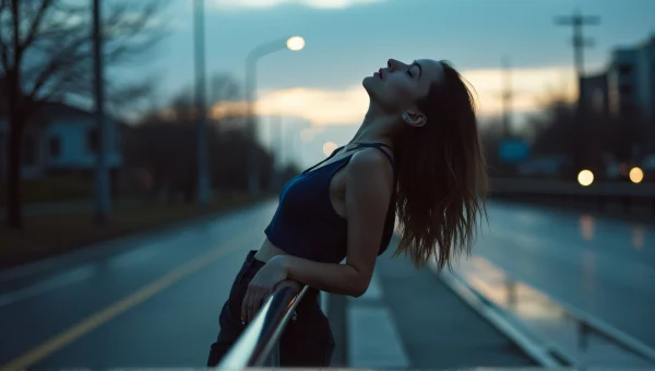 Woman Leaning on Metal Railing Under Evening Sky