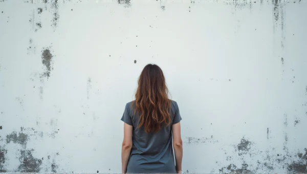 Woman Standing Before Black And White Wall