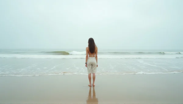 Woman Standing on Shoreline at Low Tide