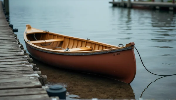 Wooden Canoe Tied at Weathered Dock Edge