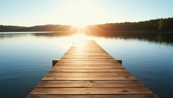 Wooden Dock Over Calm Lake Water Under Sky